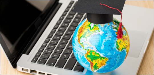 Best Study Visa Consultant in Patiala - Globe with graduation cap on laptop symbolizing top universities abroad