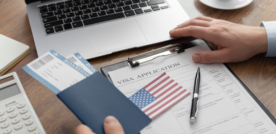 USA Visa Consultant Preparing USA study, tourist, and visitor visa application form with travel documents